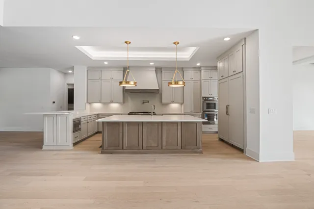 a view of a dining room with furniture and chandelier