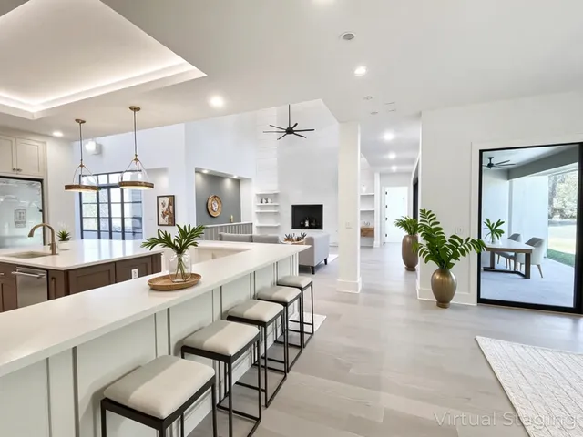 a living room with fireplace furniture and a flat screen tv