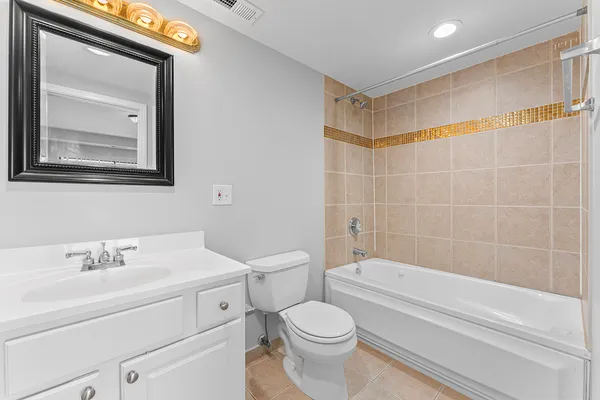 a bathroom with a toilet sink and bathtub