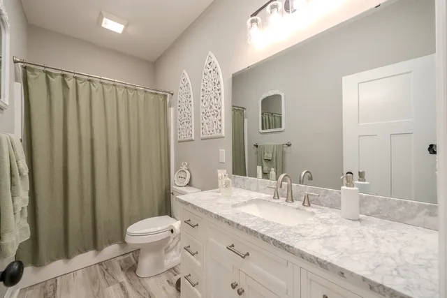 a view of washer and dryer with kitchen in the background