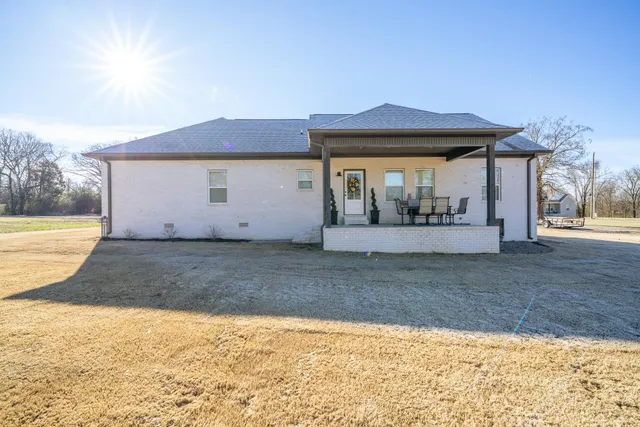a backyard of a house with wooden fence
