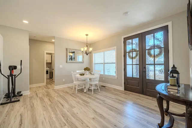a view of a dining room with furniture window and outside view