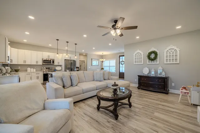 a living room with furniture fireplace and a flat screen tv