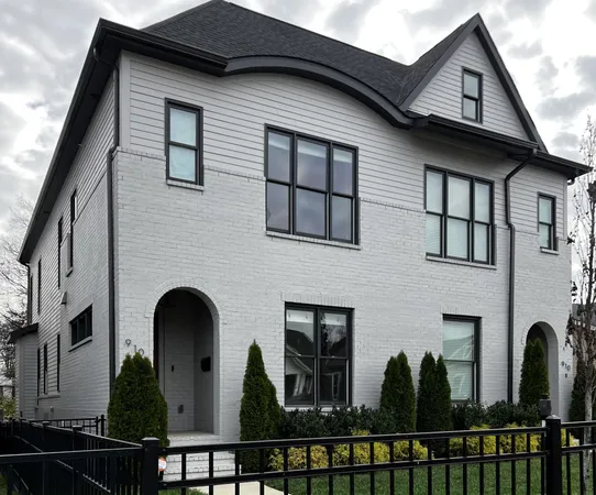 a front view of a house with glass windows