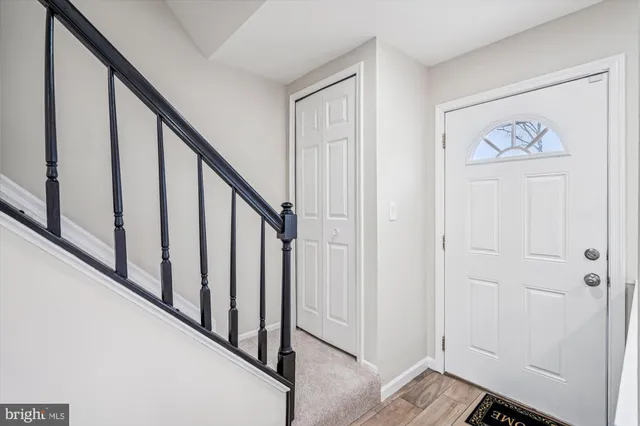 a view of an entryway with wooden floor
