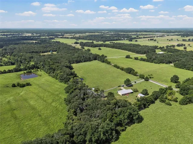 a front view of a house with a yard table and chairs