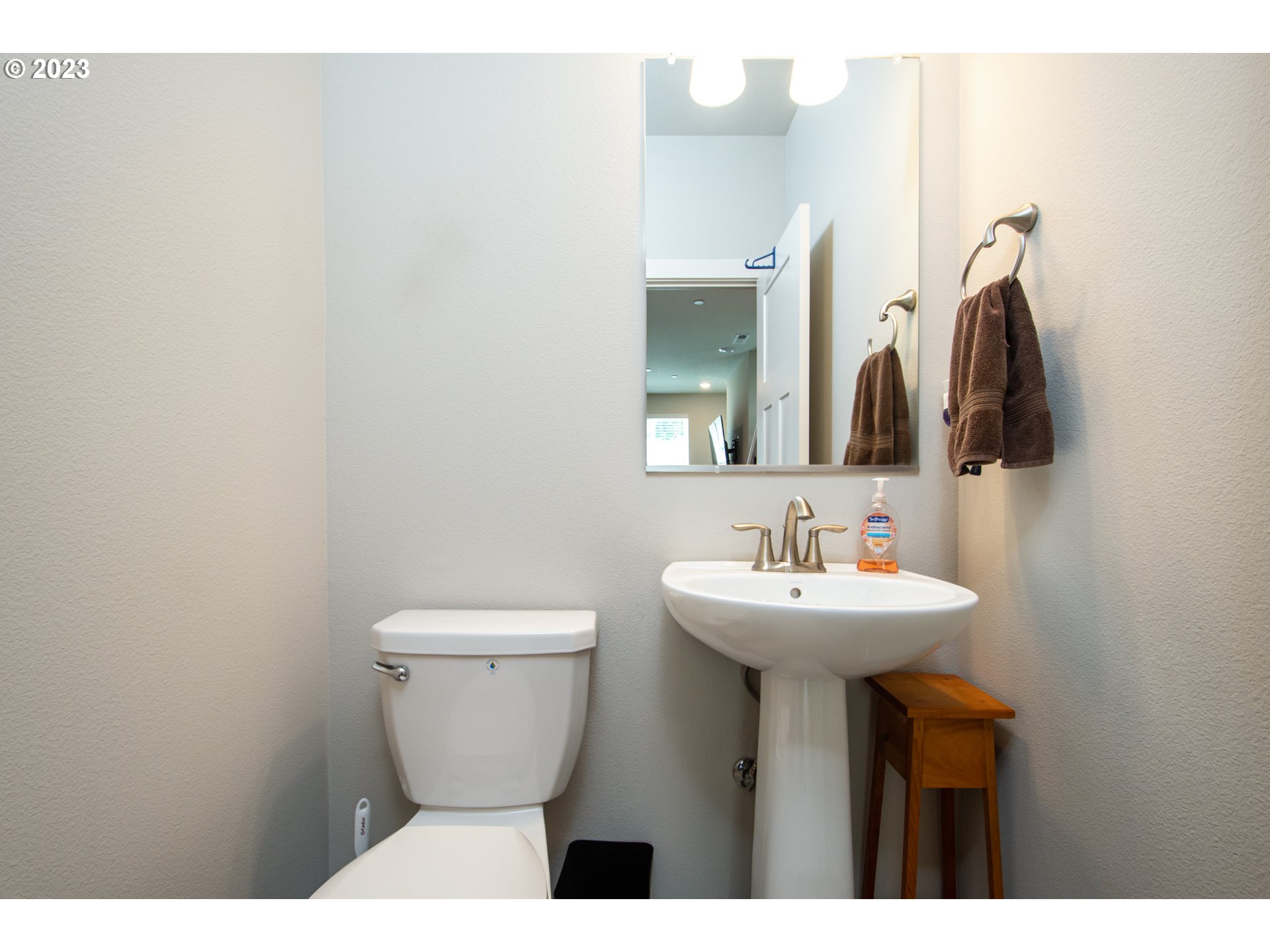4255 South Waters Edge Way Ridgefield, WA 98642 - Photo 8 of 19 a bathroom with a toilet sink and mirror