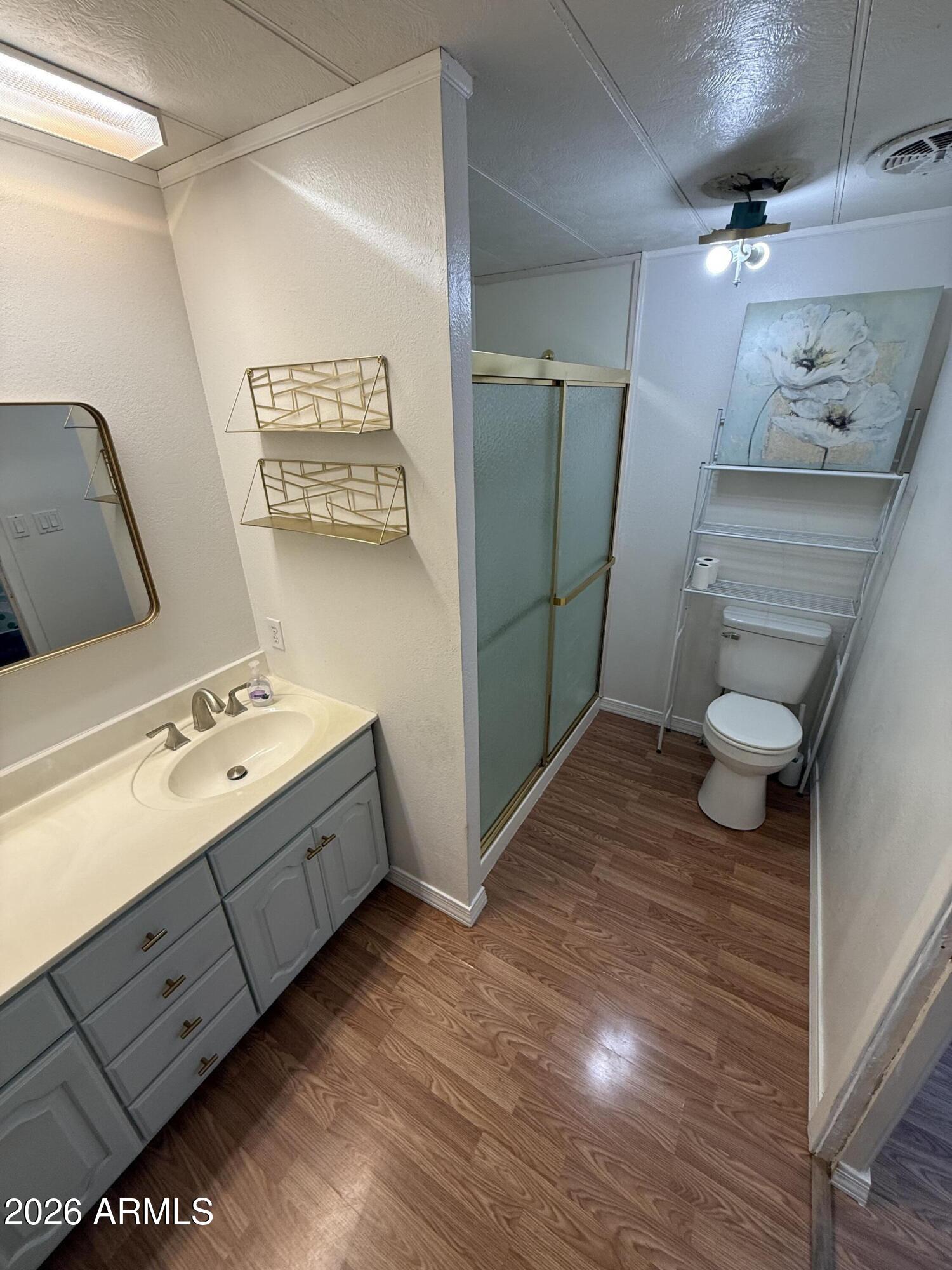 9501 East Broadway Road, Unit 48 Mesa, AZ 85208 - Photo 10 of 12 a bathroom with a sink and mirror