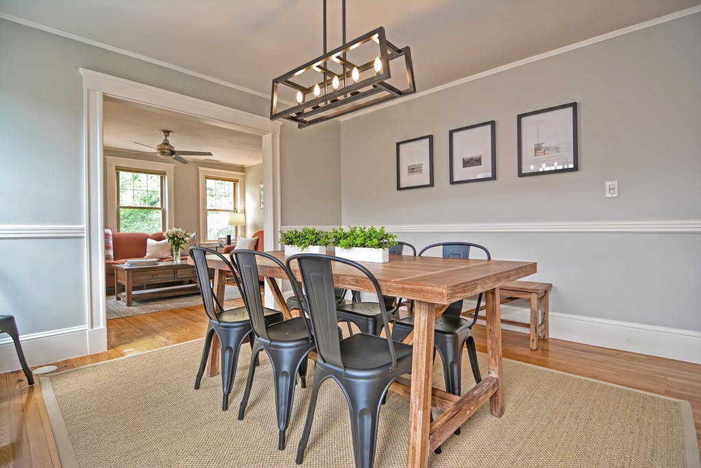 34 Bradford Road, Unit 2 Watertown, MA 02472 - Photo 13 of 39 a view of a dining room with furniture and a chandelier