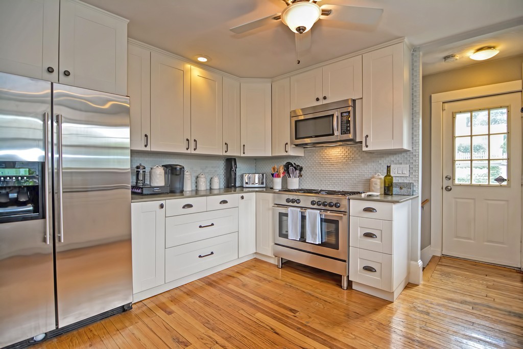 34 Bradford Road, Unit 2 Watertown, MA 02472 - Photo 2 of 39 a kitchen with stainless steel appliances granite countertop a stove a sink and a refrigerator