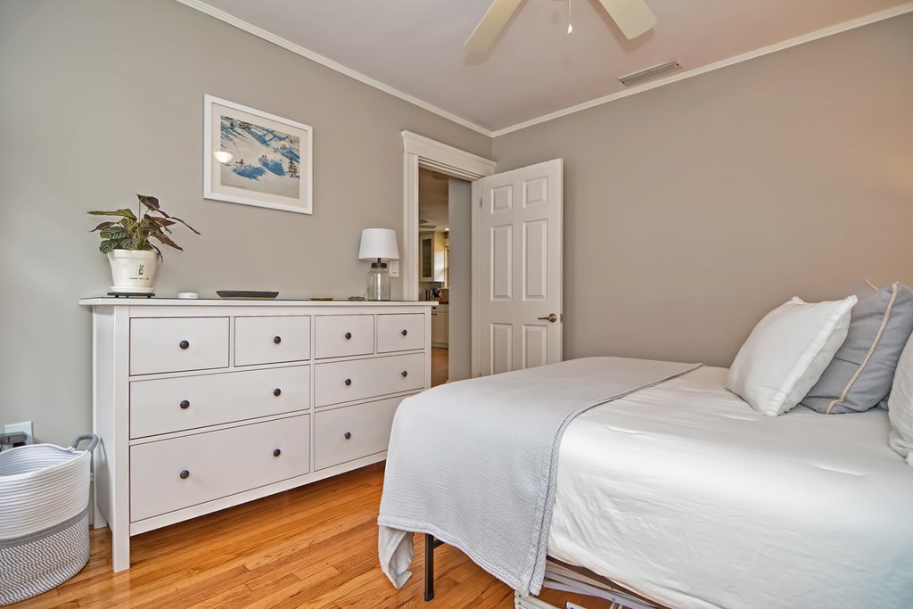 34 Bradford Road, Unit 2 Watertown, MA 02472 - Photo 26 of 39 a bedroom with a bed and a dresser