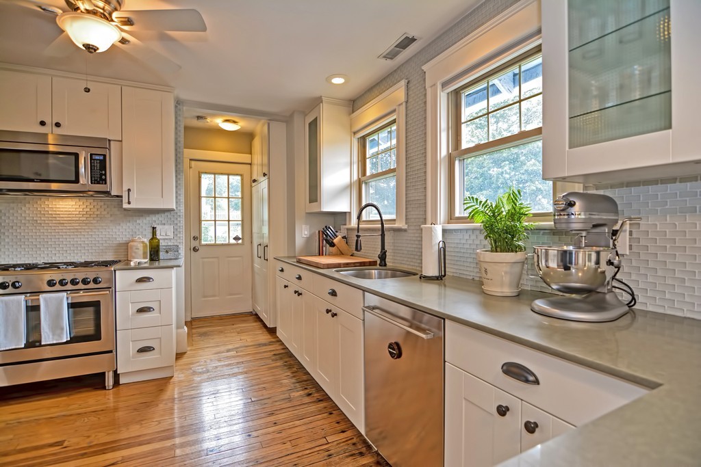 34 Bradford Road, Unit 2 Watertown, MA 02472 - Photo 3 of 39 a kitchen with sink a microwave and cabinets