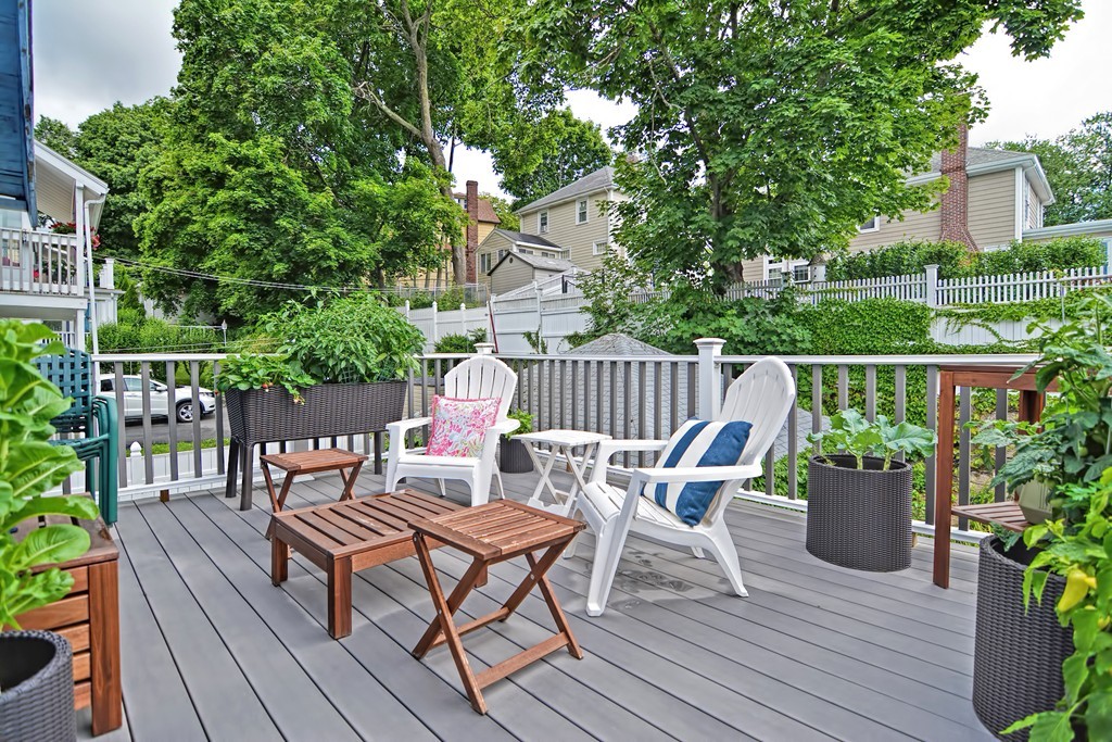 34 Bradford Road, Unit 2 Watertown, MA 02472 - Photo 32 of 39 a view of a chairs and table on the wooden deck