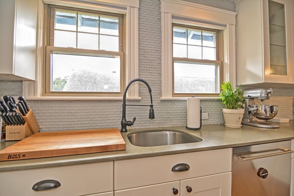 34 Bradford Road, Unit 2 Watertown, MA 02472 - Photo 8 of 39 a kitchen with a sink a counter and a window