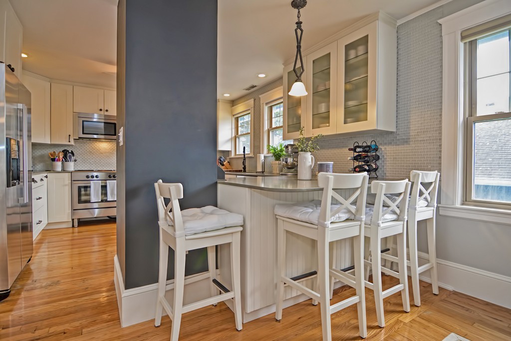 34 Bradford Road, Unit 2 Watertown, MA 02472 - Photo 9 of 39 a dining room with furniture and wooden floor