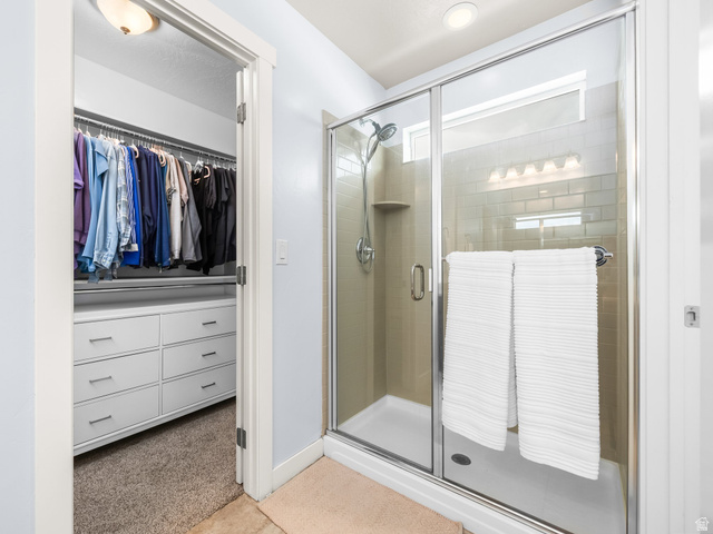 834 West 1050th Street South Springville, UT 84663 - Photo 15 of 26 Glass-enclosed shower with subway tile surround, recessed lighting