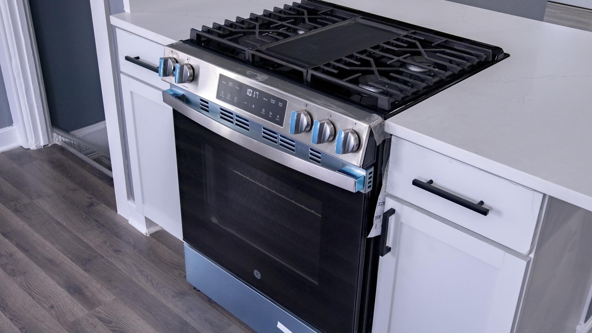 418 Dallas Street Gary, IN 46406 - Photo 14 of 22 a close up of a stove sitting inside of a kitchen