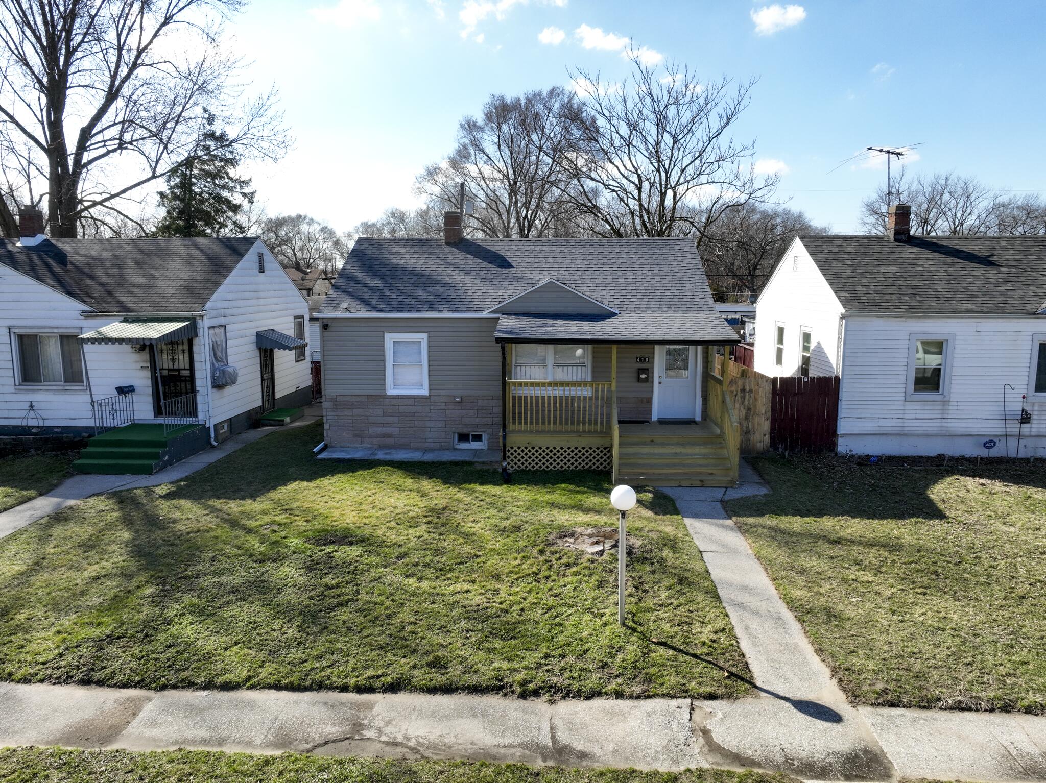 418 Dallas Street Gary, IN 46406 - Photo 20 of 22 a front view of a house with a yard