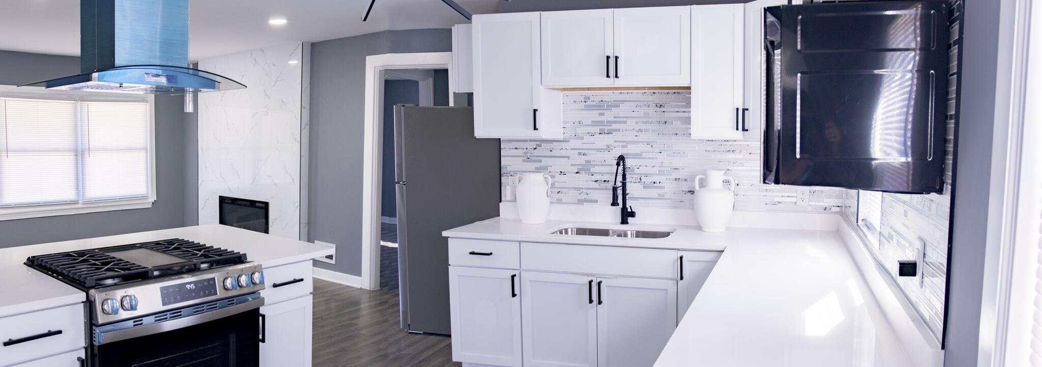 418 Dallas Street Gary, IN 46406 - Photo 8 of 22 a kitchen with a sink stove and refrigerator