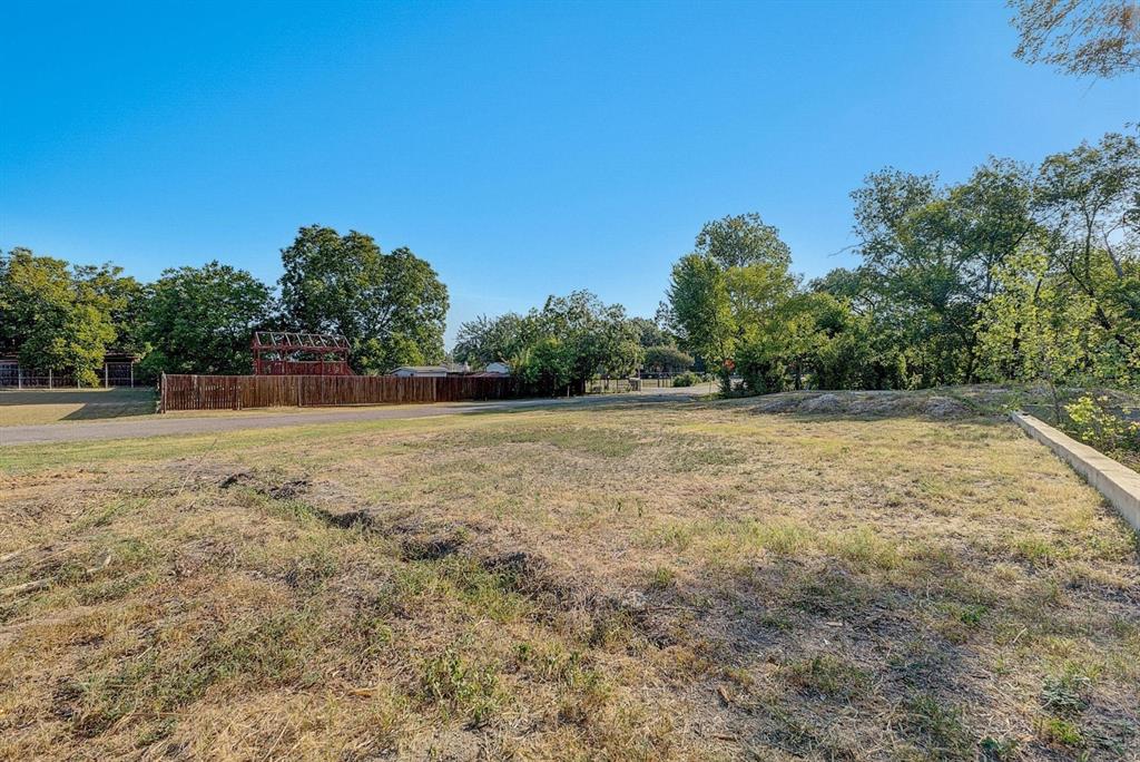 6724 Starbuck Drive Dallas, TX 75252 - Photo 13 of 30 a view of a field with trees in the background