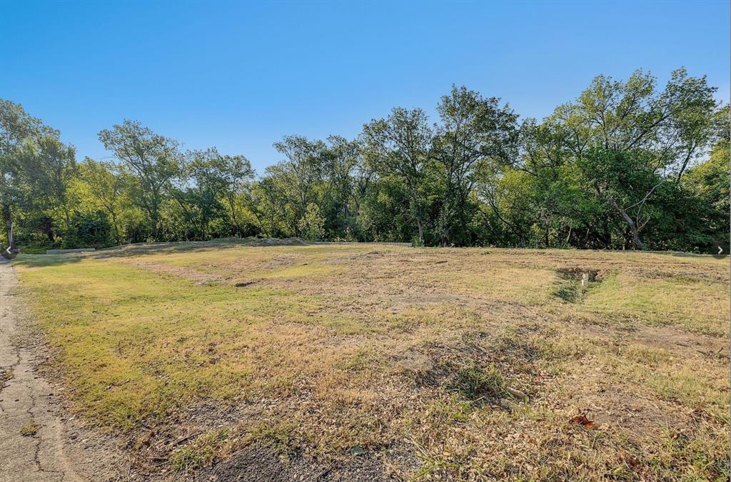 6724 Starbuck Drive Dallas, TX 75252 - Photo 16 of 30 a view of a field with trees in the background