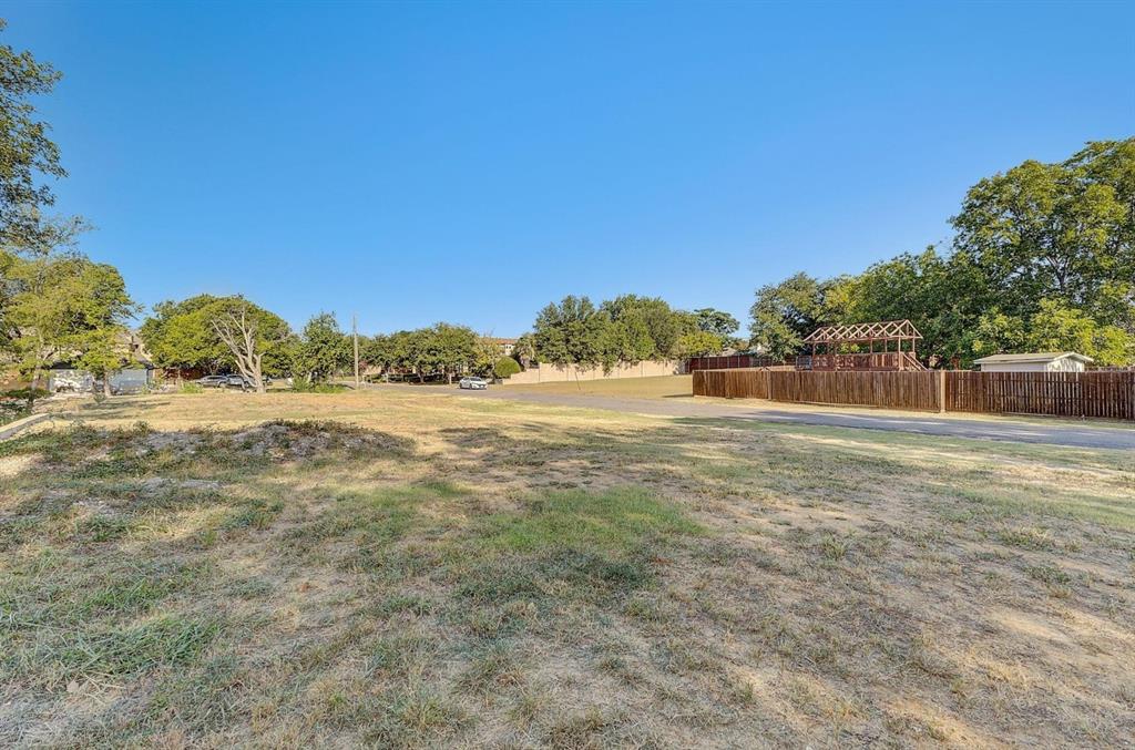 6724 Starbuck Drive Dallas, TX 75252 - Photo 18 of 30 a view of a field of grass and trees