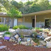 a view of a chair and table in a yard