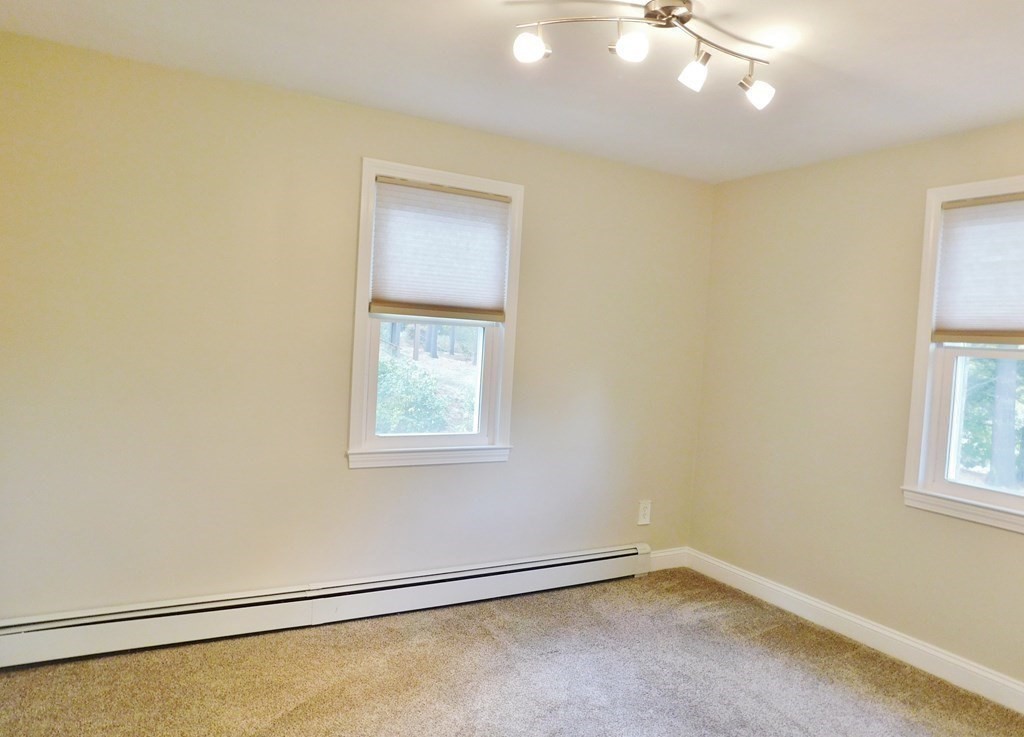 214 Hartwick Street Springfield, MA 01108 - Photo 16 of 25 a view of an empty room with a window
