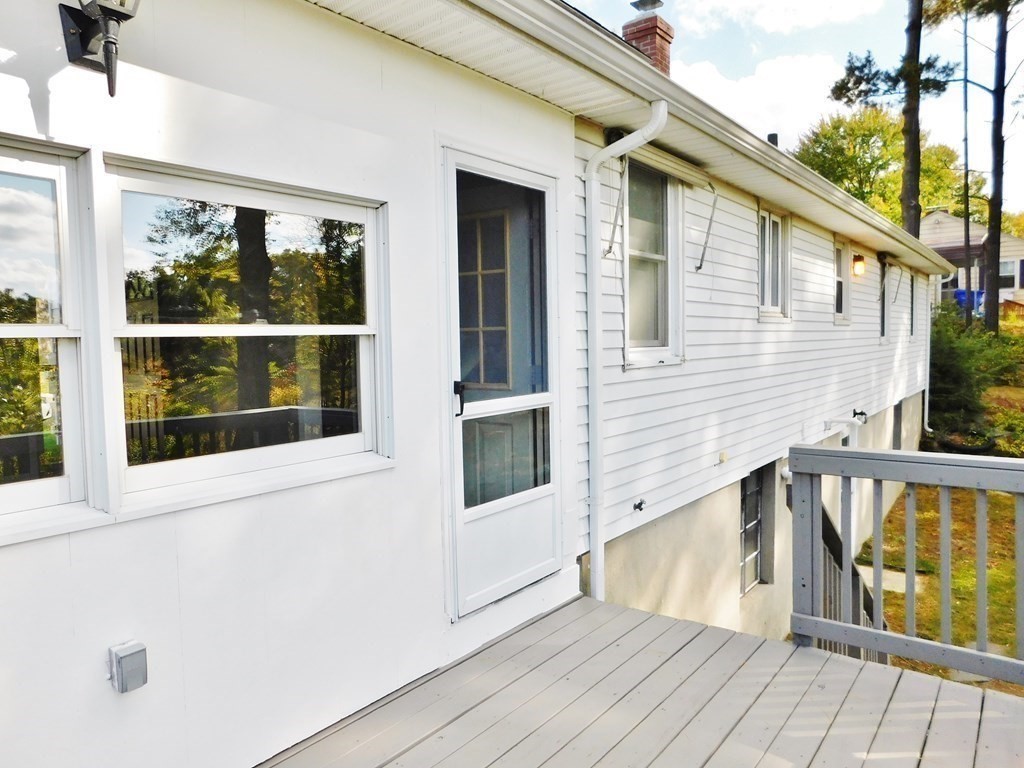 214 Hartwick Street Springfield, MA 01108 - Photo 22 of 25 a view of a balcony with wooden floor and fence