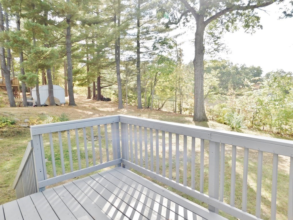 214 Hartwick Street Springfield, MA 01108 - Photo 23 of 25 a view of roof deck with wooden floor and fence