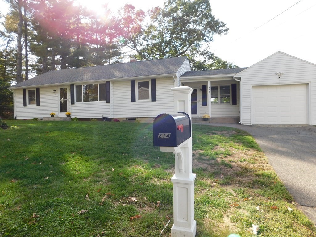 214 Hartwick Street Springfield, MA 01108 - Photo 25 of 25 a front view of a house with a yard and garage