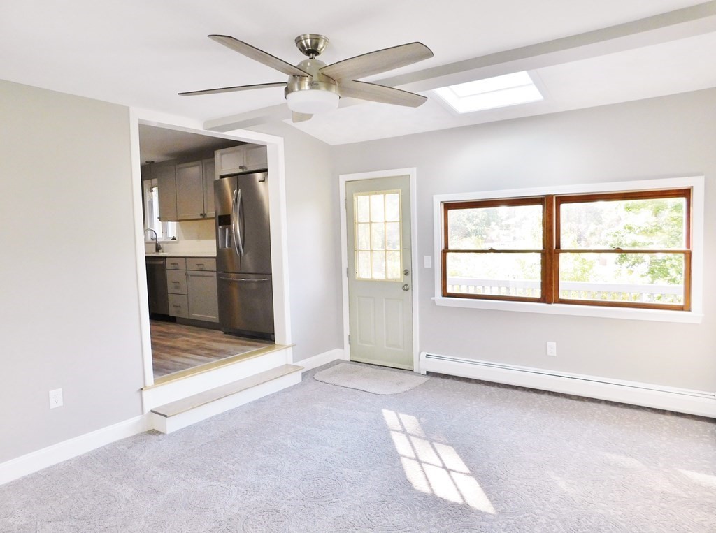 214 Hartwick Street Springfield, MA 01108 - Photo 4 of 25 a view of livingroom with a ceiling fan and window