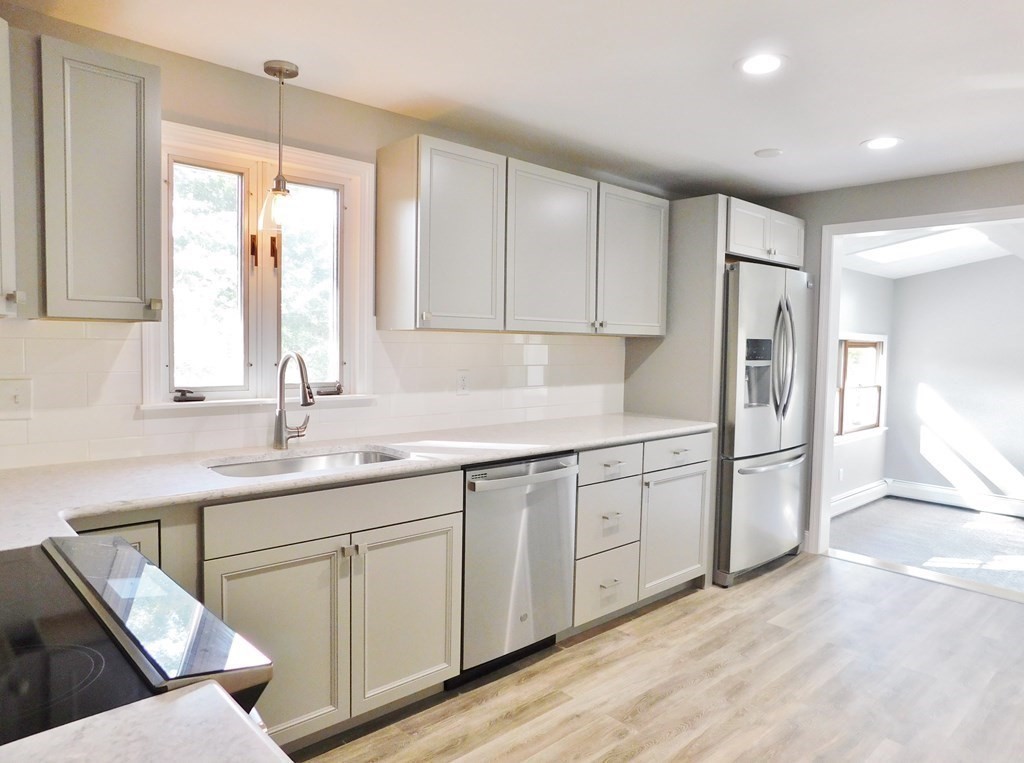214 Hartwick Street Springfield, MA 01108 - Photo 5 of 25 a kitchen with a sink cabinets and window