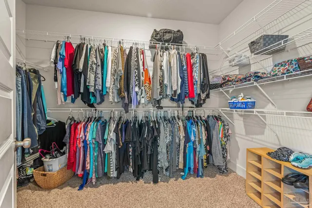 a kitchen with stainless steel appliances granite countertop a stove top oven a sink dishwasher and microwave oven with cabinets