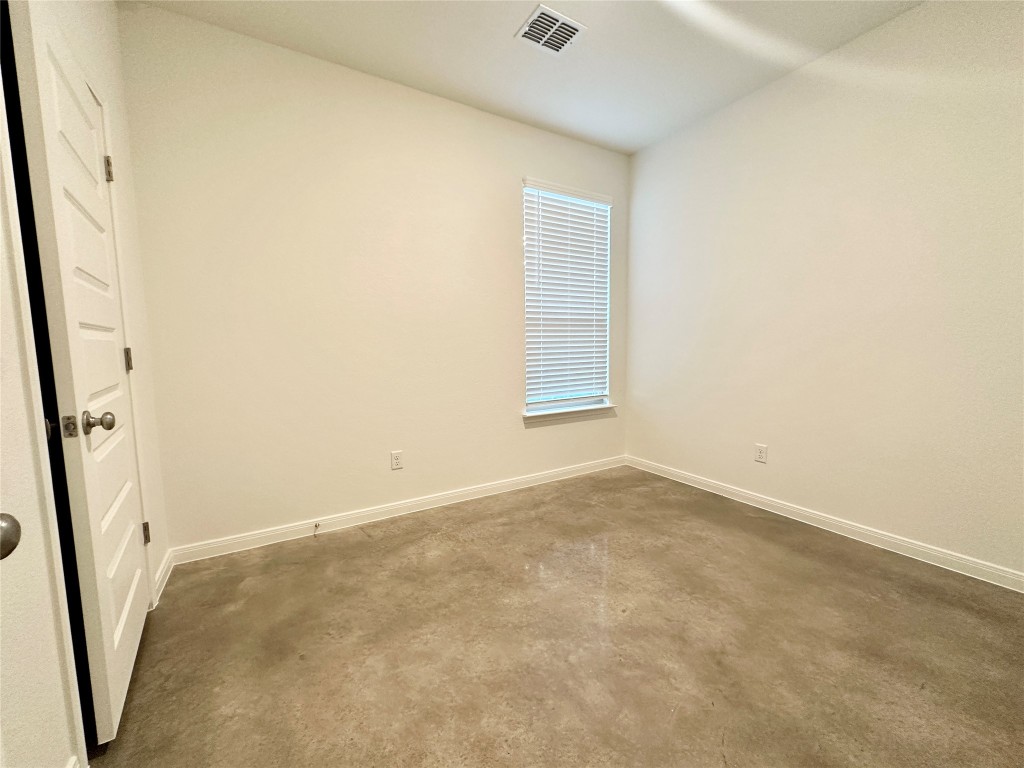 2913 Quail Rdg Lane, Unit A Temple, TX 76501 - Photo 7 of 19 Unfurnished room featuring baseboards and concrete floors