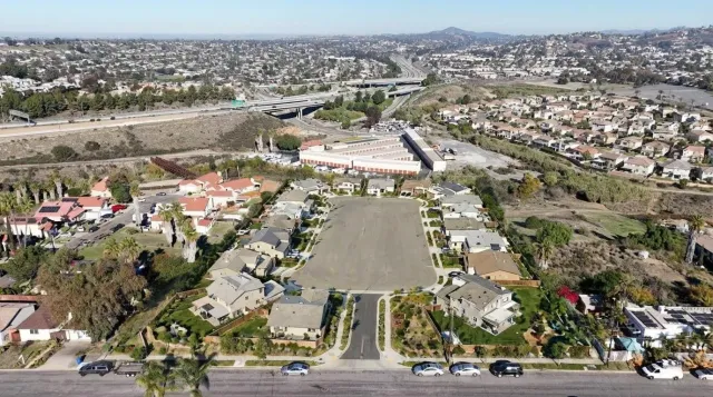 an aerial view of residential houses with outdoor space