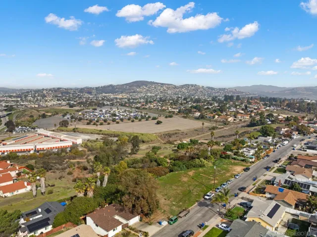 an aerial view of residential houses with outdoor space