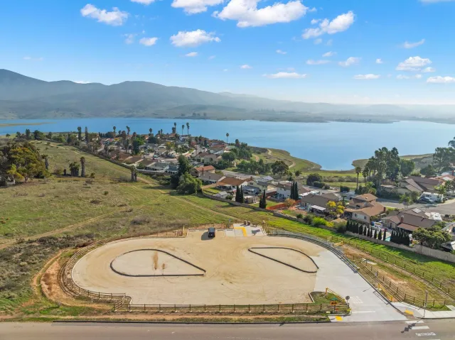 an aerial view of a residential houses with outdoor space