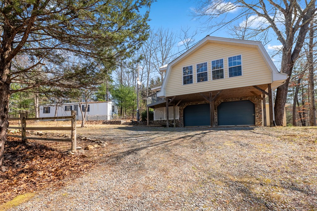 1262 Maple Grove Road Morganton, GA 30560 - Photo 13 of 68 a front view of a house with a yard
