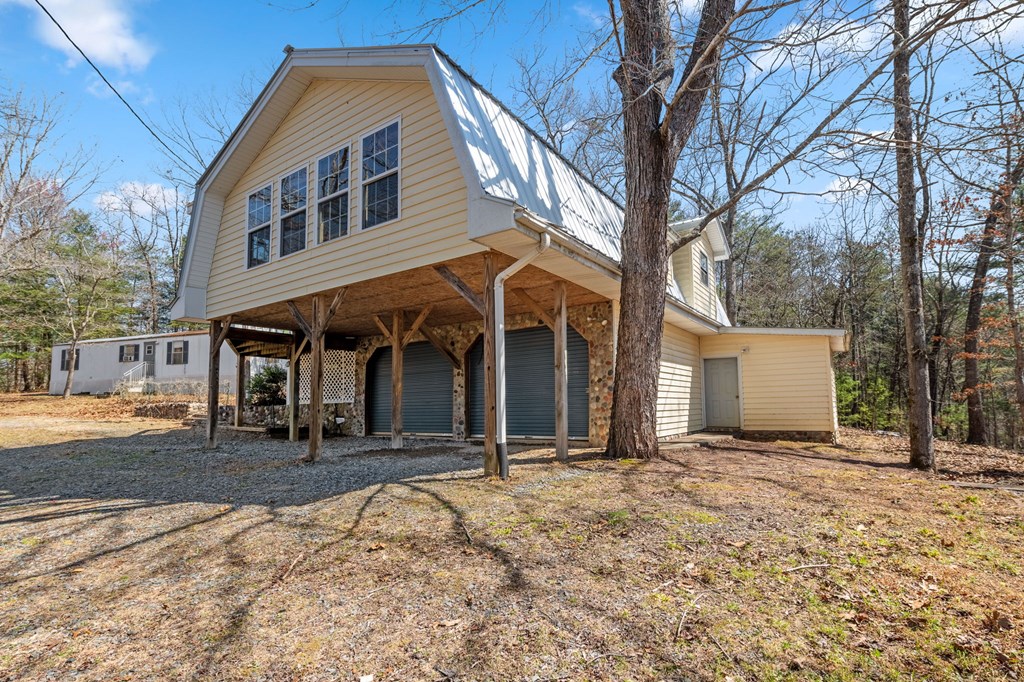 1262 Maple Grove Road Morganton, GA 30560 - Photo 20 of 68 a front view of a house with a yard