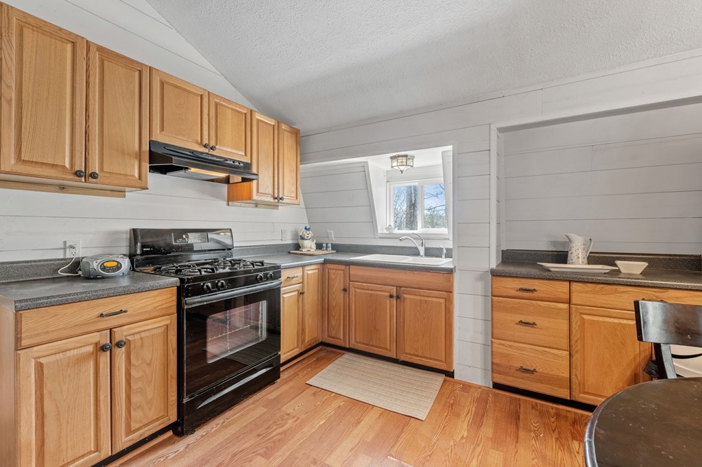 1262 Maple Grove Road Morganton, GA 30560 - Photo 21 of 68 a kitchen with stainless steel appliances granite countertop a stove sink and cabinets