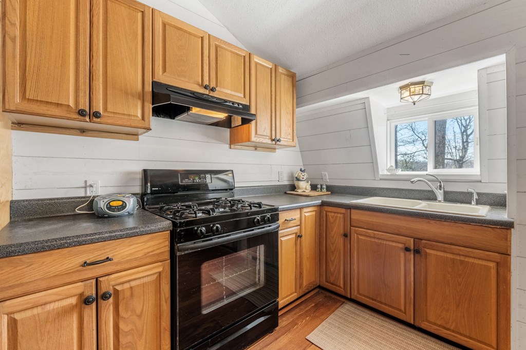 1262 Maple Grove Road Morganton, GA 30560 - Photo 23 of 68 a kitchen with granite countertop cabinets stainless steel appliances and a sink