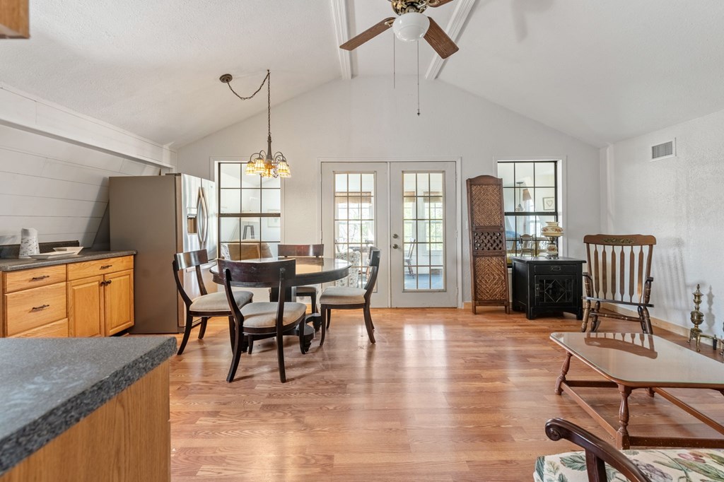 1262 Maple Grove Road Morganton, GA 30560 - Photo 25 of 68 a dining room with furniture a chandelier and wooden floor