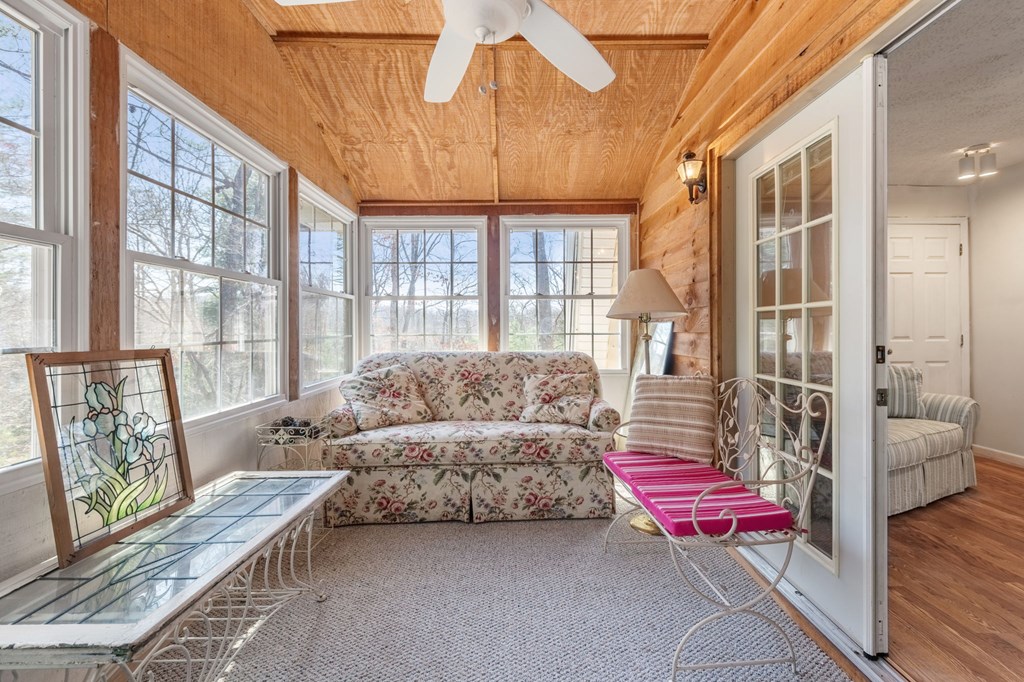 1262 Maple Grove Road Morganton, GA 30560 - Photo 31 of 68 a living room with furniture and a floor to ceiling window