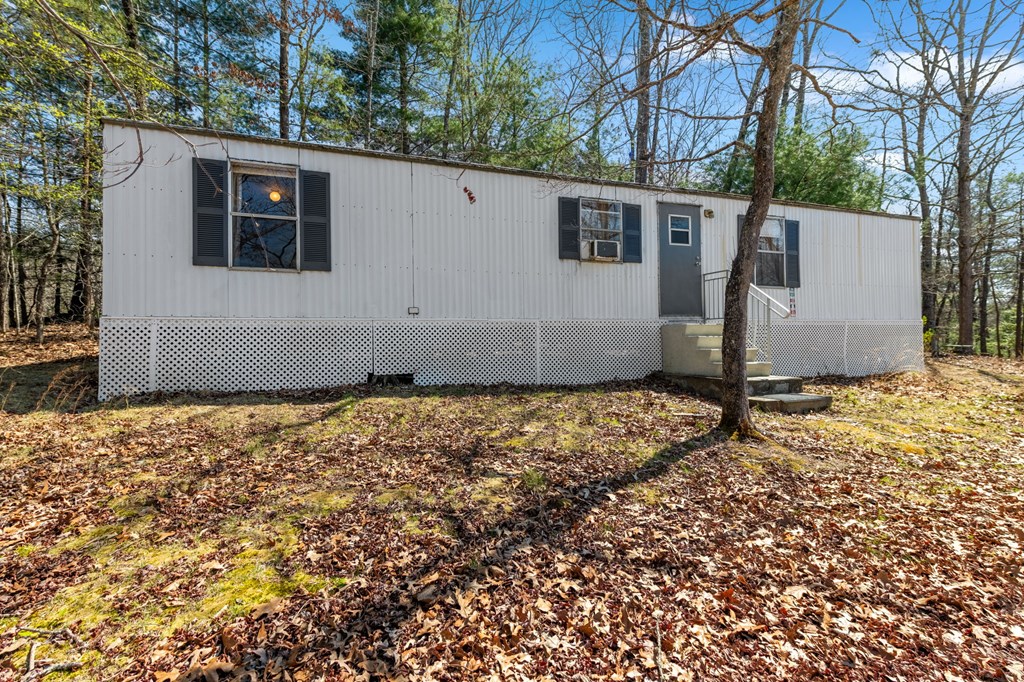 1262 Maple Grove Road Morganton, GA 30560 - Photo 41 of 68 a view of a house with a yard