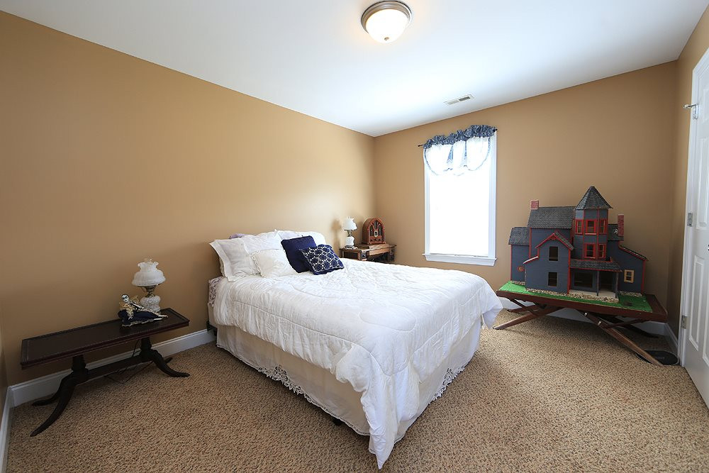 214 Steve Ridge Willow Spring, NC 27592 - Photo 21 of 29 One of three bedrooms upstairs - this one overlooking the back yard - all have nice sized closets. Bedroom