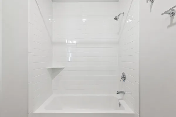 a close up of a bathtub curtain