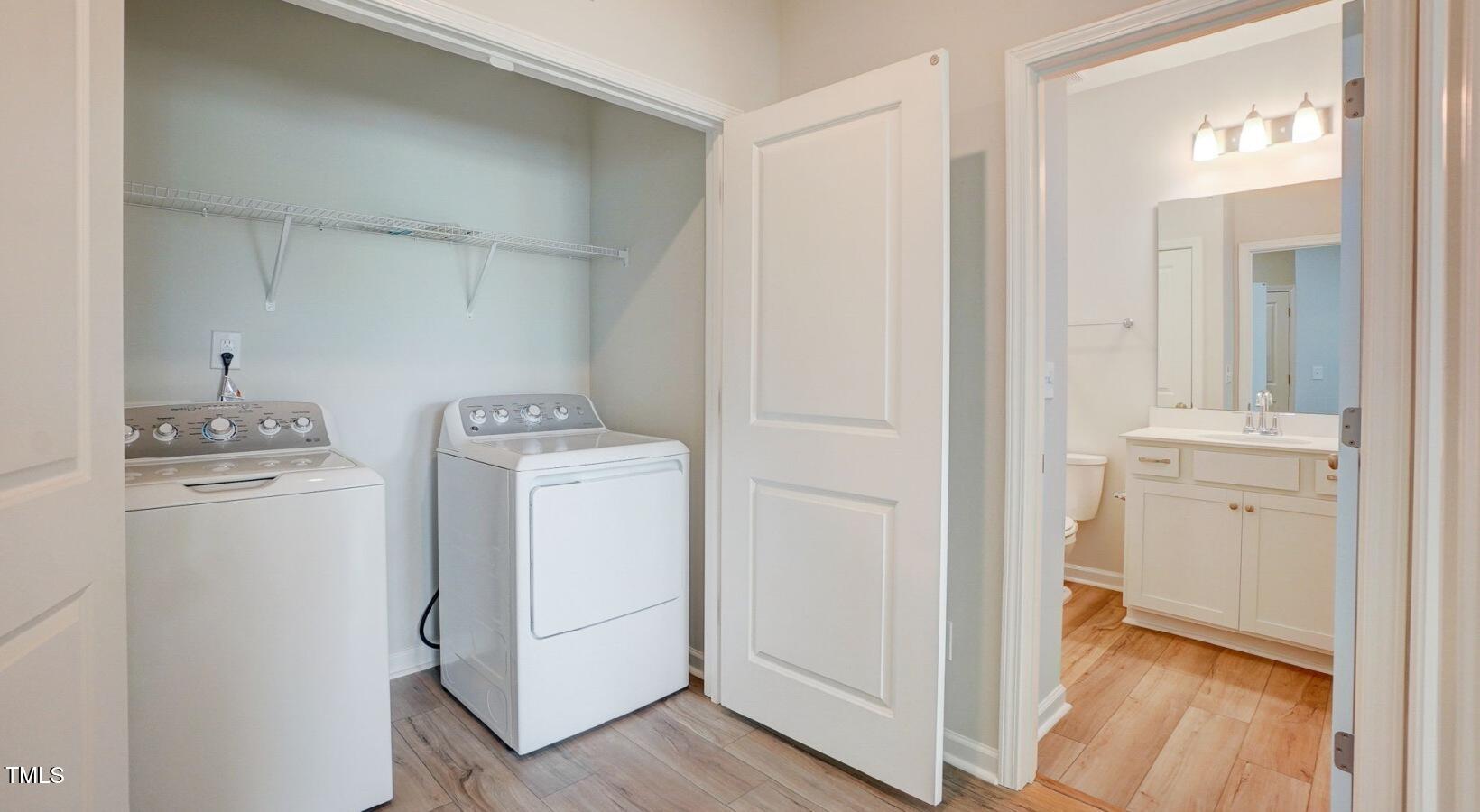 101 Decatur Drive, Unit WATSONIA Raleigh, NC 27603 - Photo 21 of 24 a view of storage and utility room with washer and dryer
