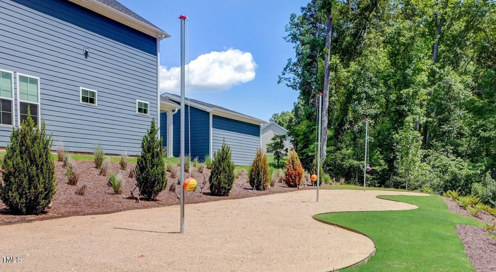 101 Decatur Drive, Unit WATSONIA Raleigh, NC 27603 - Photo 23 of 24 a view of a house with backyard and a tree