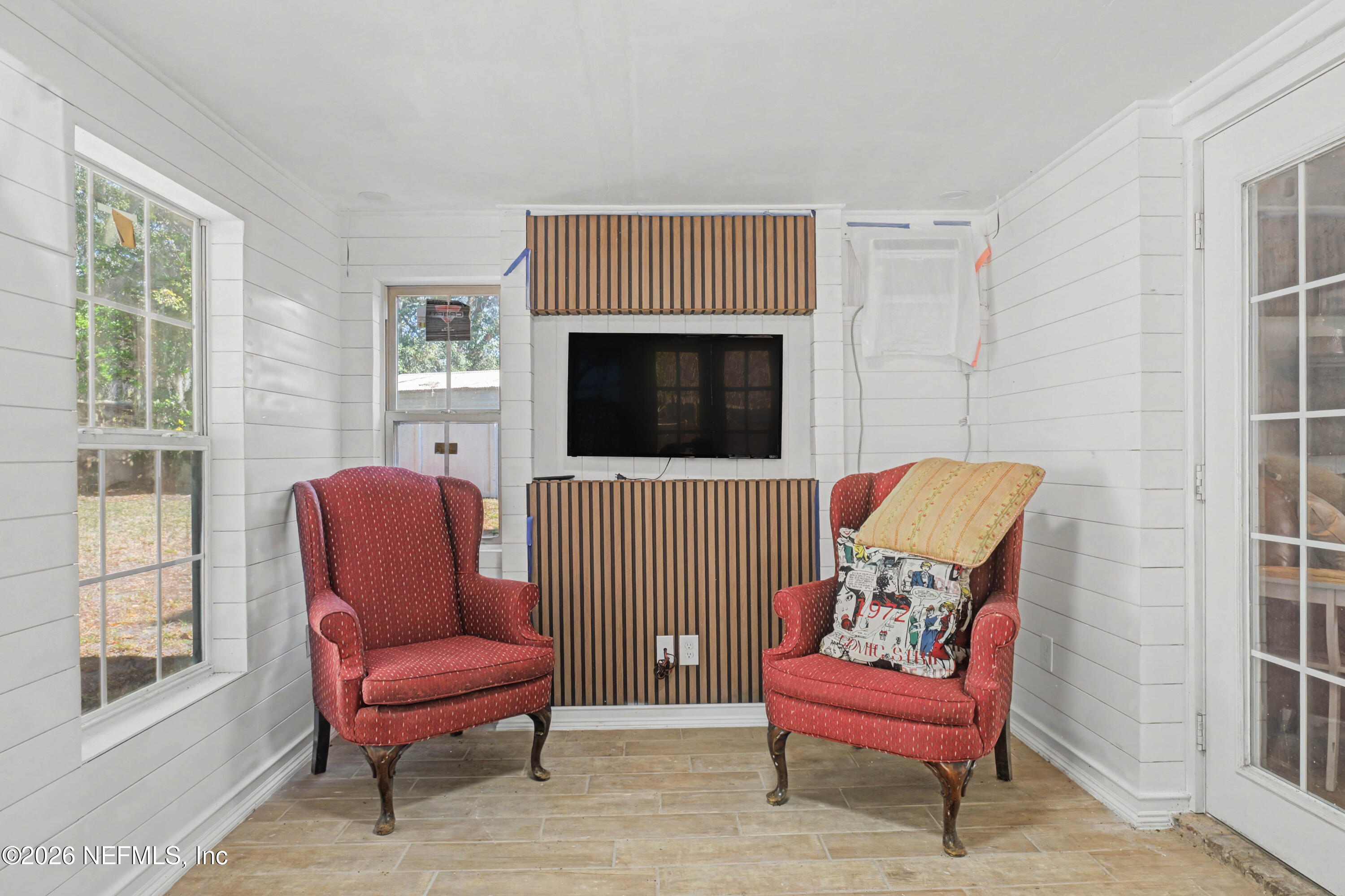 1502 Pointer Drive West Jacksonville, FL 32221 - Photo 18 of 33 a living room with furniture a flat screen tv and a fireplace